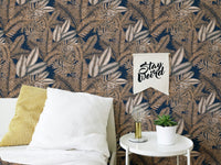 Seamless pattern tropical dry leaves wallpaper behind a white bed and pillow.