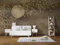 Abstract golden bird wall mural behind a modern white sideboard and wooden ladder in kids room.