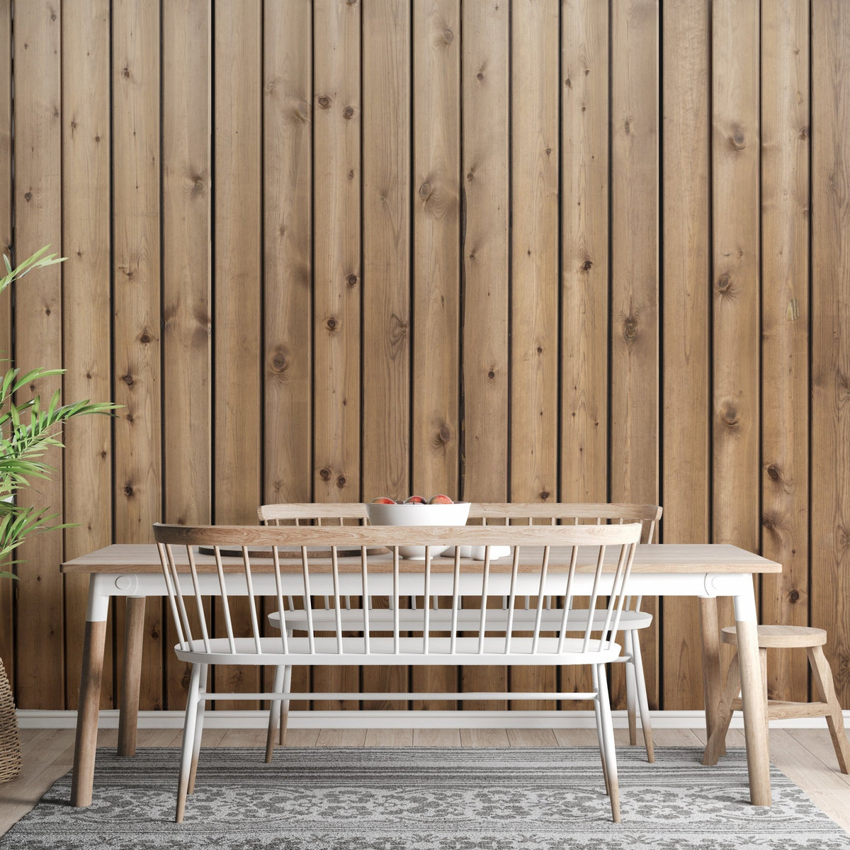 Rustic wood slat wall mural in a dining area with a long wooden table.