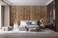 Vertical wood plank wall mural behind a modern bed in large bedroom.