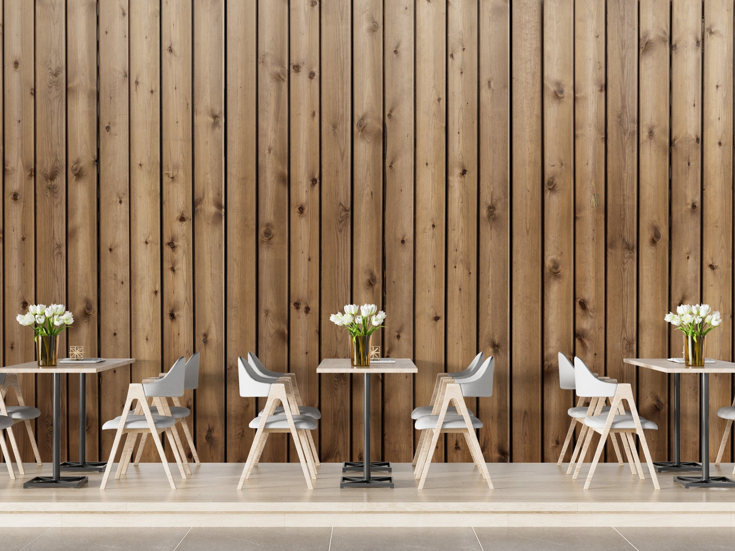 Narrow wood strip wall mural behind small cafe tables and white chairs.