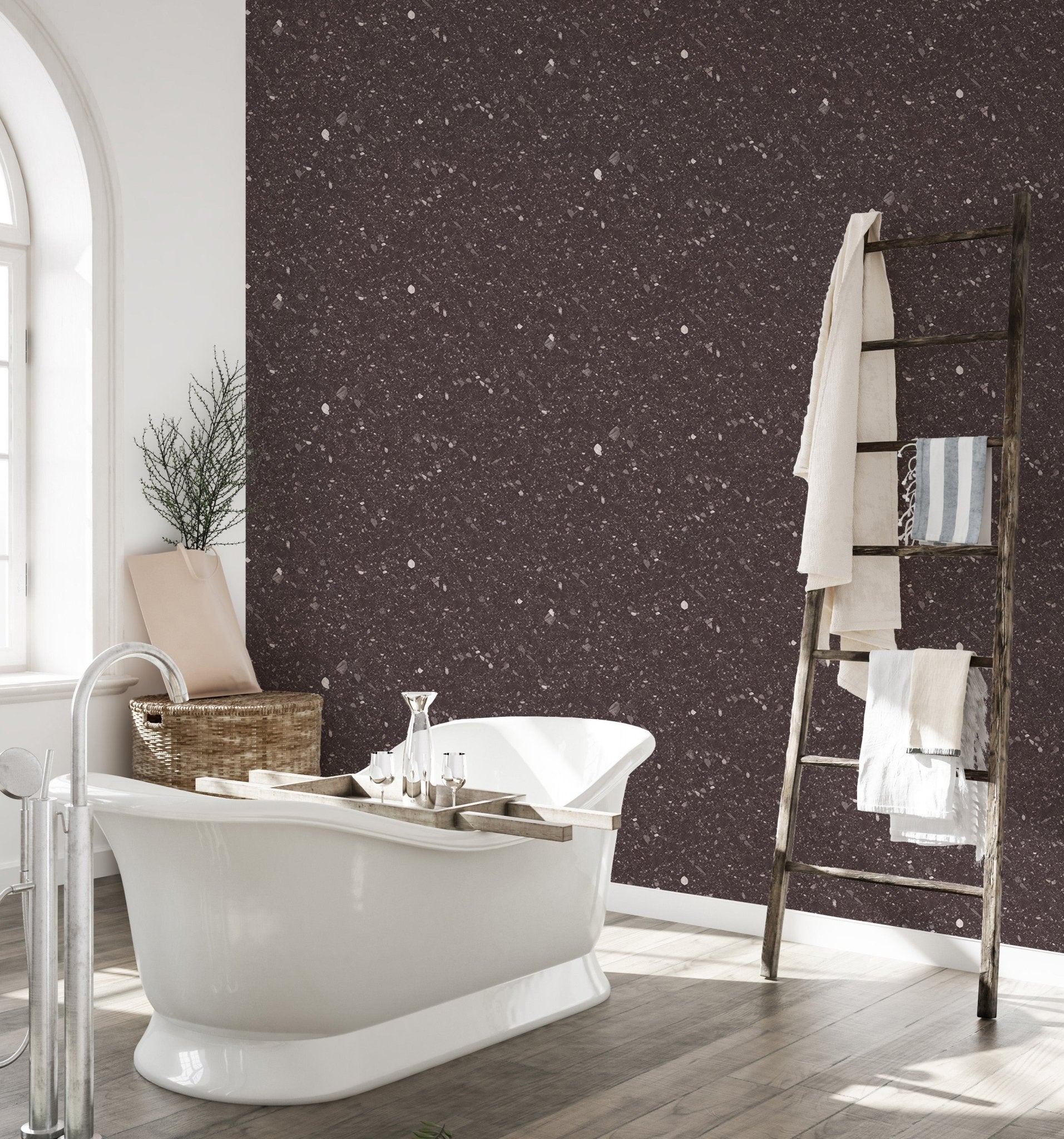 Dark brown quartz wallpaper in a bathroom with a white freestanding bathtub.