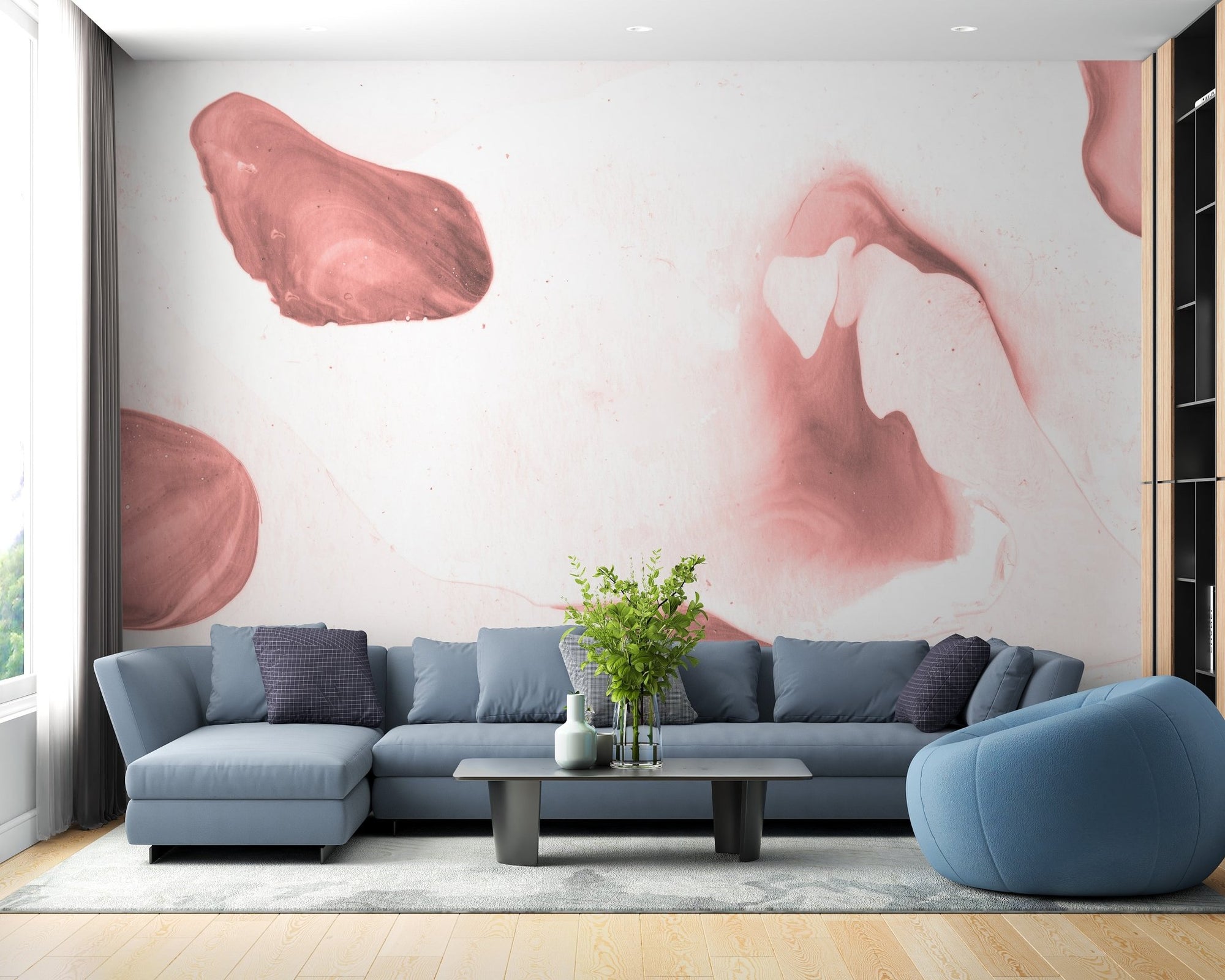 Brushstroke Blush Wall Mural in a living room with a blue sectional sofa.