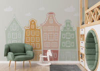 Artistic wall mural with colorful building block patterns in nursery.
