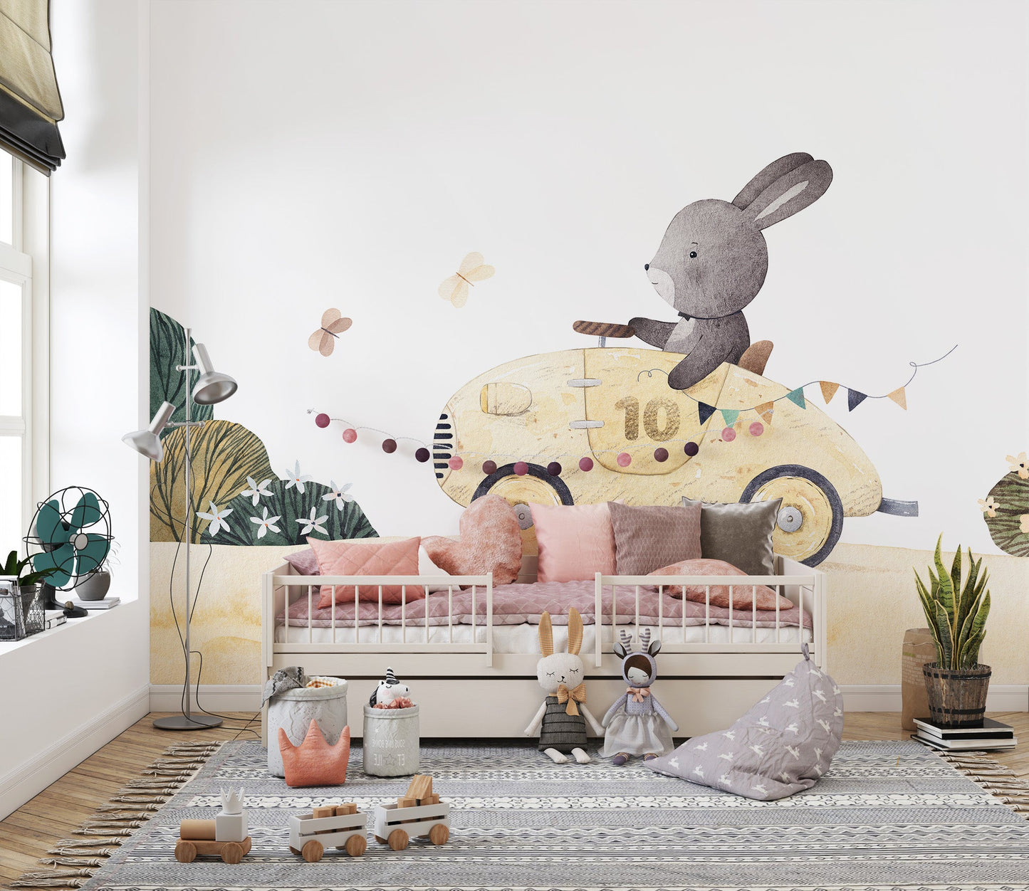 Nursery style bunny in yellow vehicle wall mural decor.