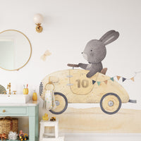 Woodland bunny car journey wall mural with floral bushes illustration.