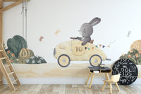 Vintage race car bunny illustration wall mural in pastel shade.