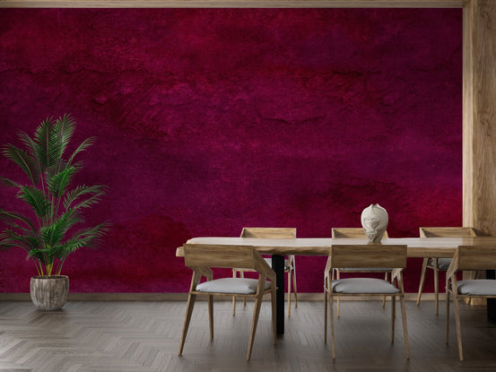Burgundy brushstrokes wall mural behind a wooden dining table set.