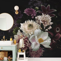 Dark bouquet floral wall mural behind a mint green vanity and round mirror