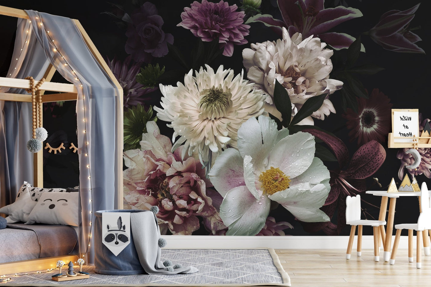 Dark oasis floral wall mural behind a wooden bed frame in a kids bedroom