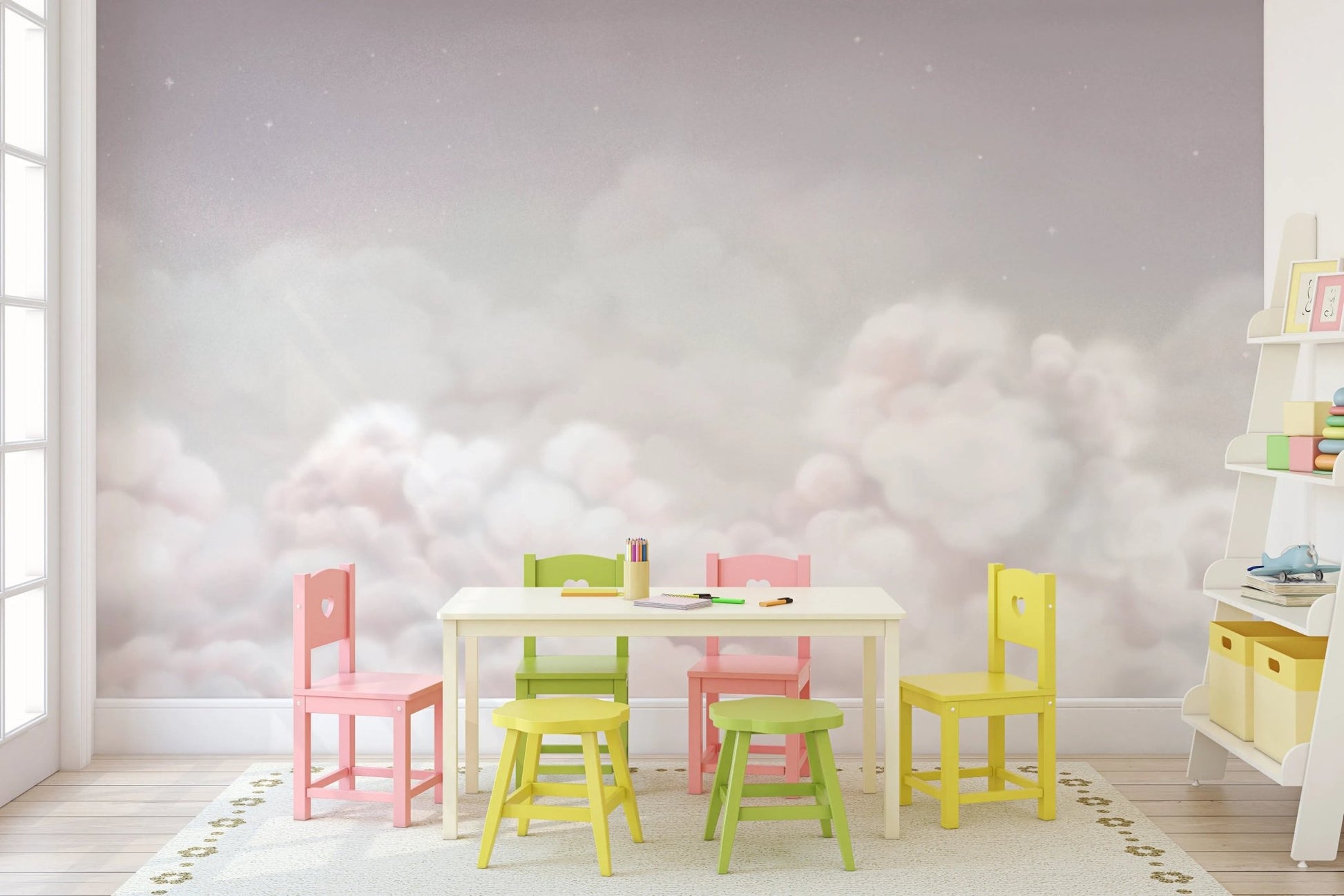 Pastel cloud wall mural in a playroom with a colorful small table and chairs set.