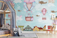 City skyline wall mural with illustrated houses for a children's sleeping area.