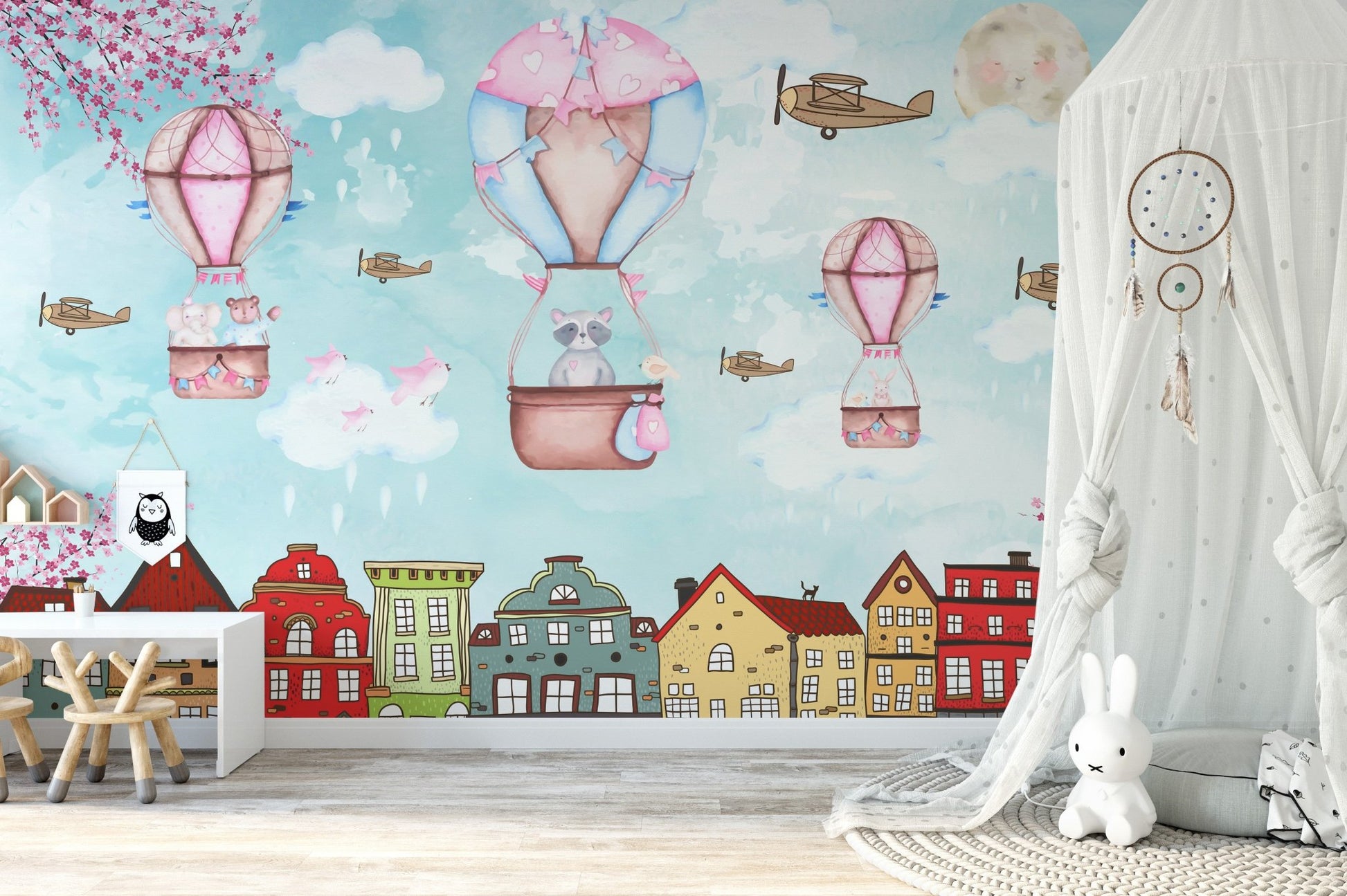 Pastel colored city mural for a nursery feature wall with soft textures.