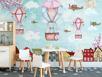 Aerial escapade mural with a cartoon city theme for kids dining area.