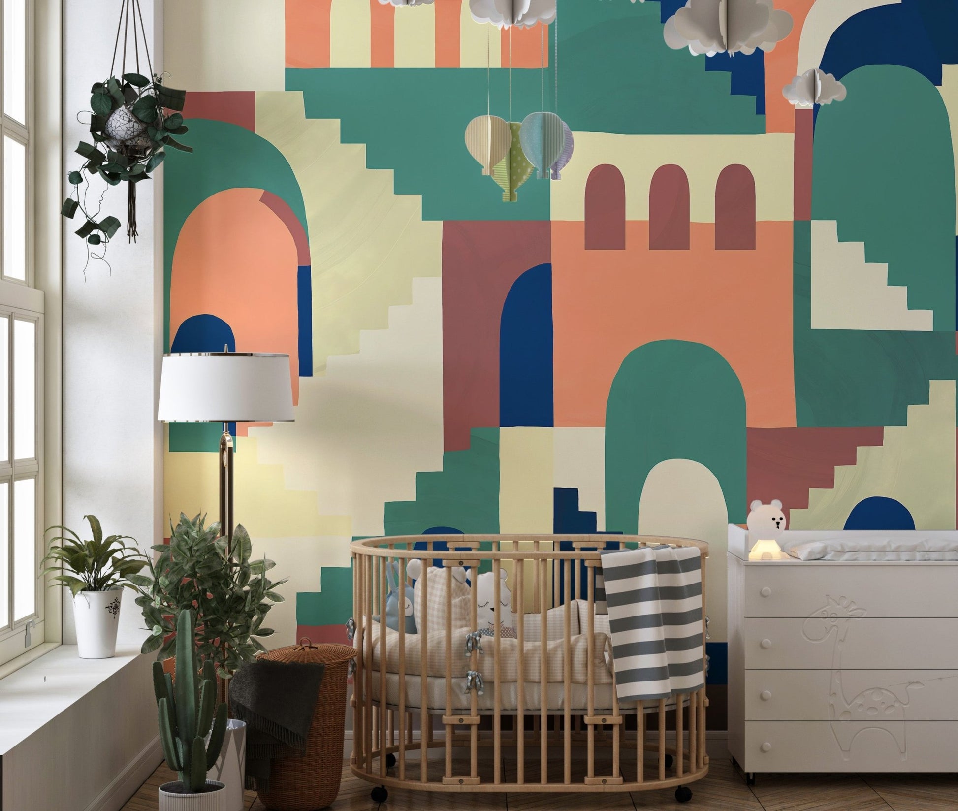 Cartoon maze abstract multicolor kids room wall mural in a nursery with a cot.