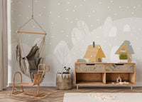 Toddler bedroom wall mural with a wooden crib and hanging chair against mountain.