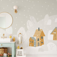Bathroom wall mural featuring grey mountains and a yellow house design.


