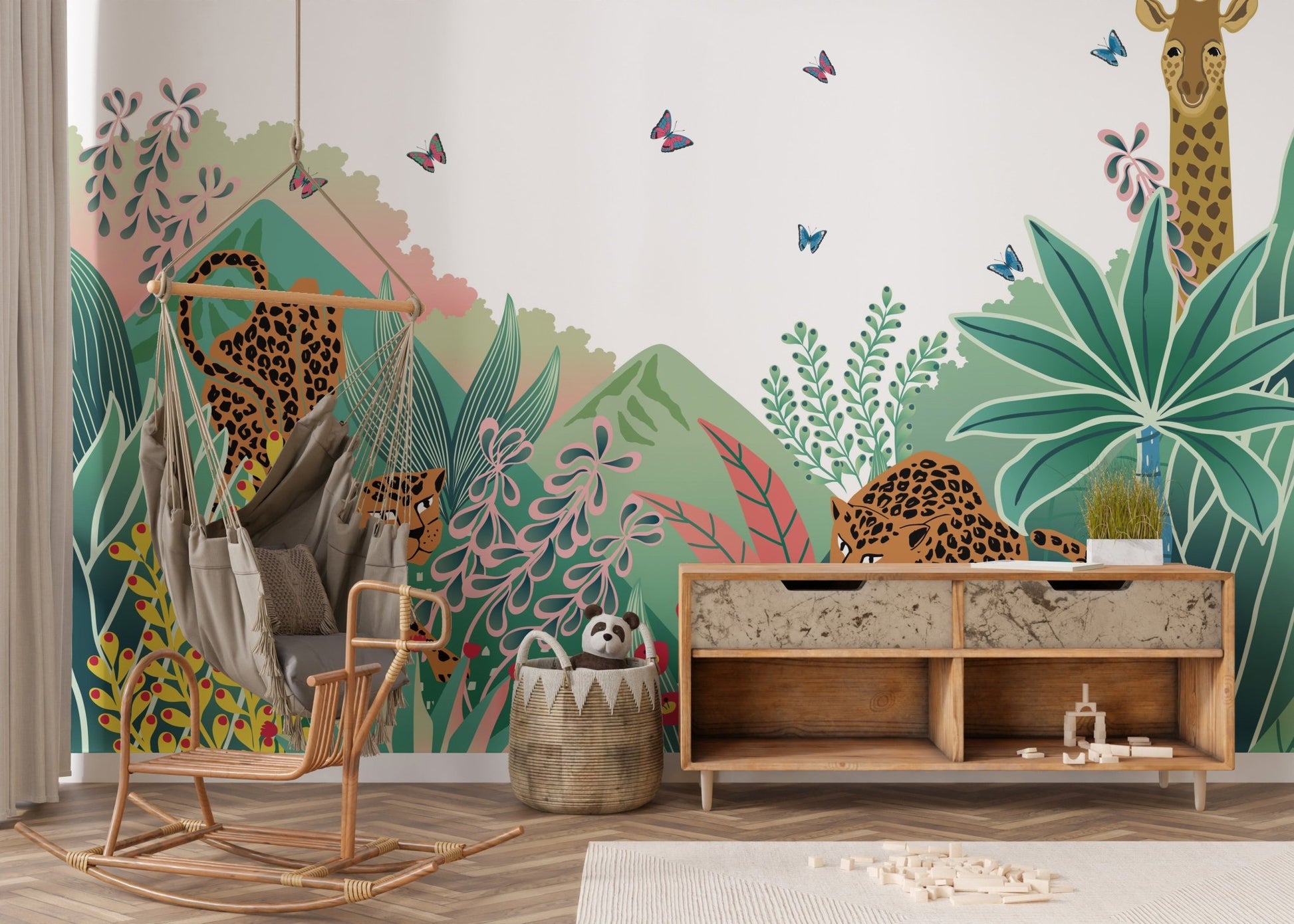 Safari animal wall mural in a kid’s room with wooden furniture and toys.