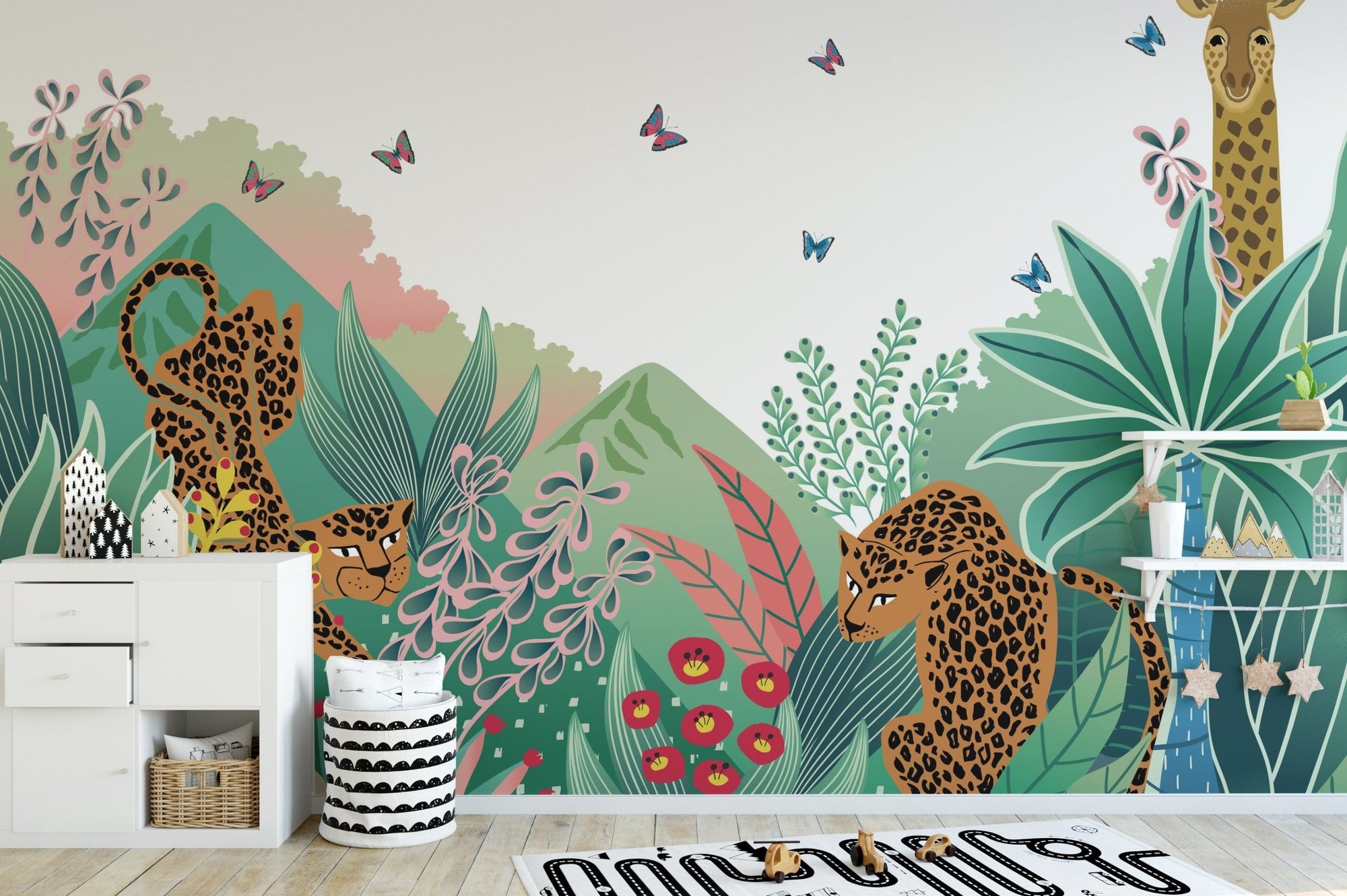 Cartoon Safari Tales wall mural with leopards and giraffes in a bright nursery.