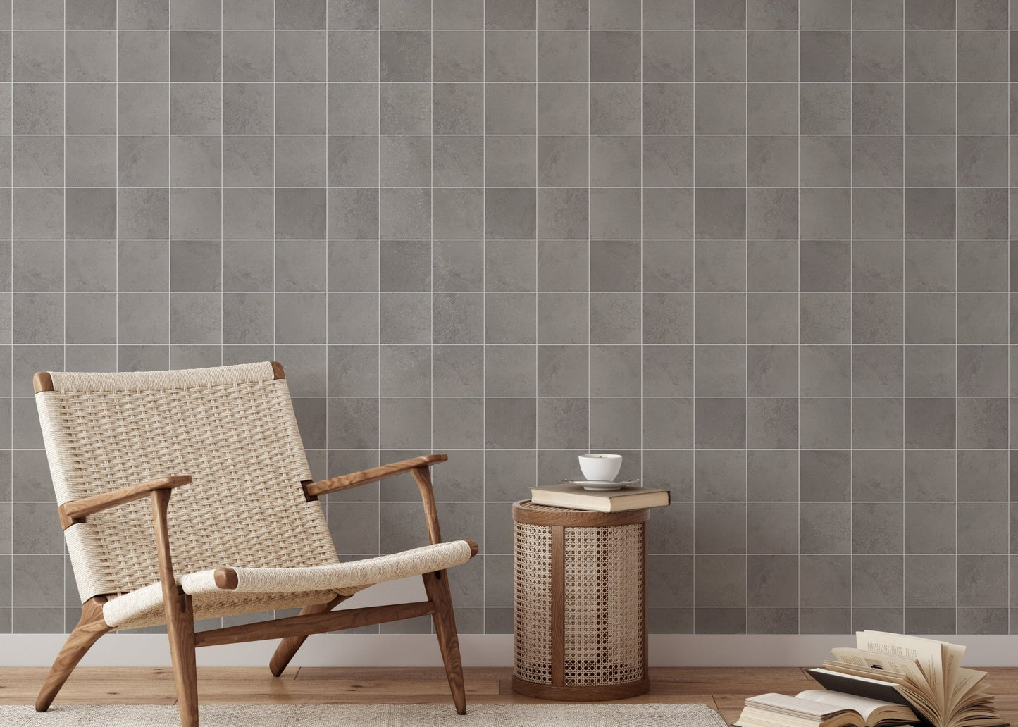 Textured ceramic grey tiles wallpaper in a reading area with a wooden chair.
