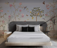 Large grey crane standing among garden shrubs wall mural for bedroom.