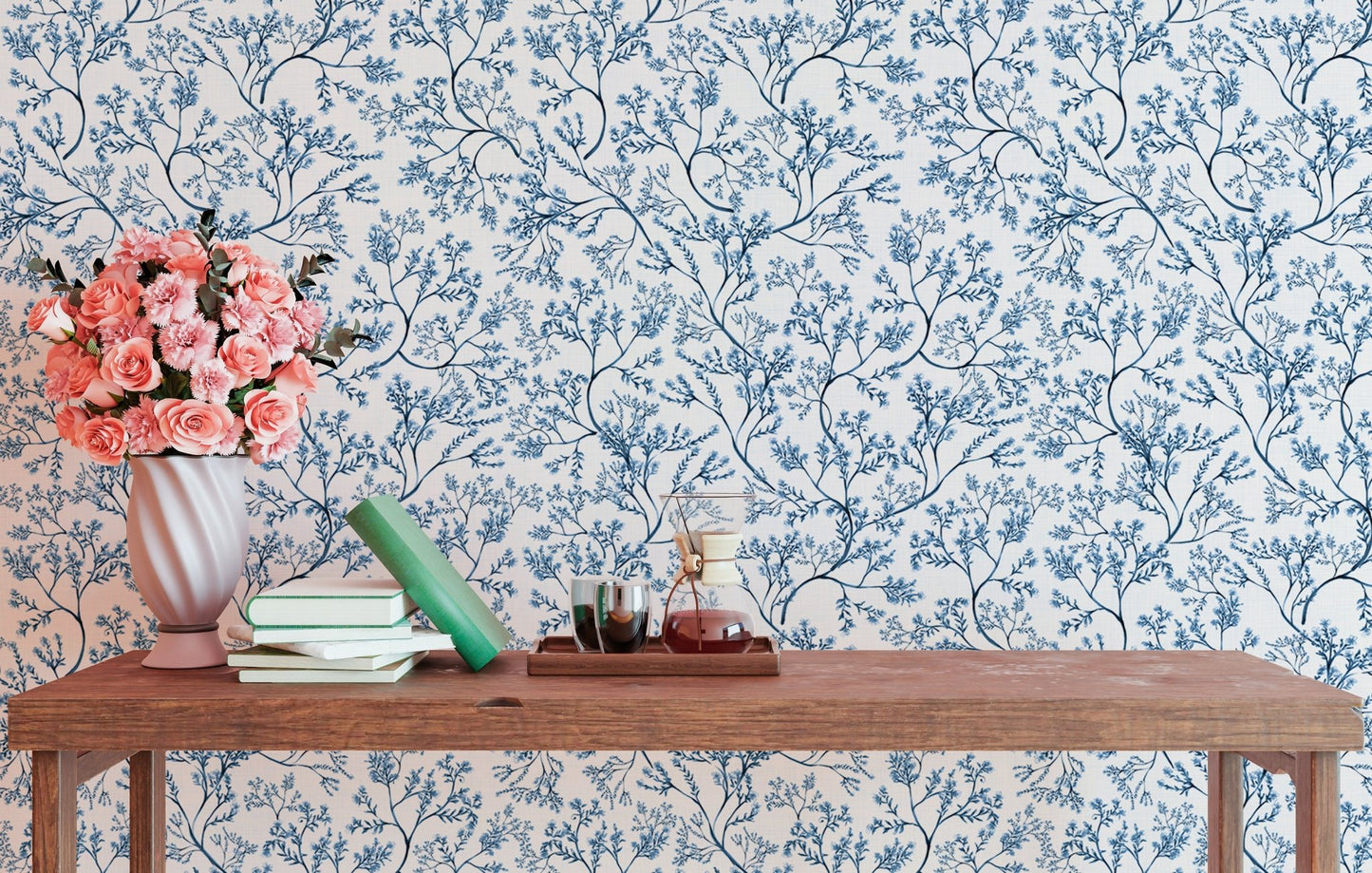 Classic nostalgic botanical wallpaper behind a wooden table with flowers