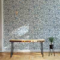 Classic nostalgic botanical wallpaper behind a live edge wooden table