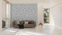 Chinoiserie wild flower wallpaper in a large living room with a grey sofa