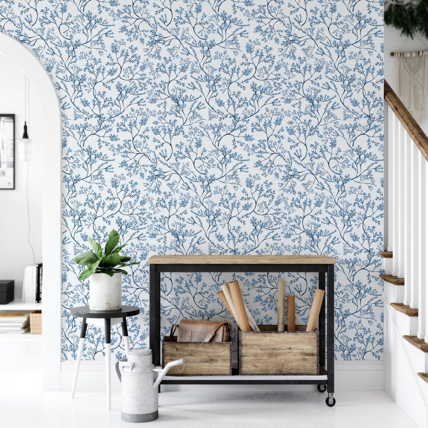 Nostalgic botanical wallpaper in an entryway with a black console table