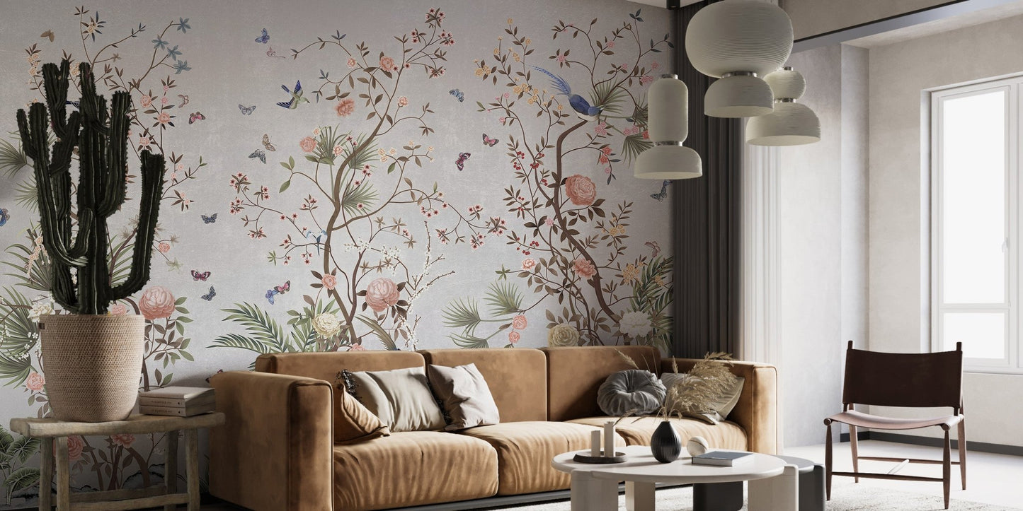 Artistic wall mural with blue birds and pink flowers in a sunlit room.