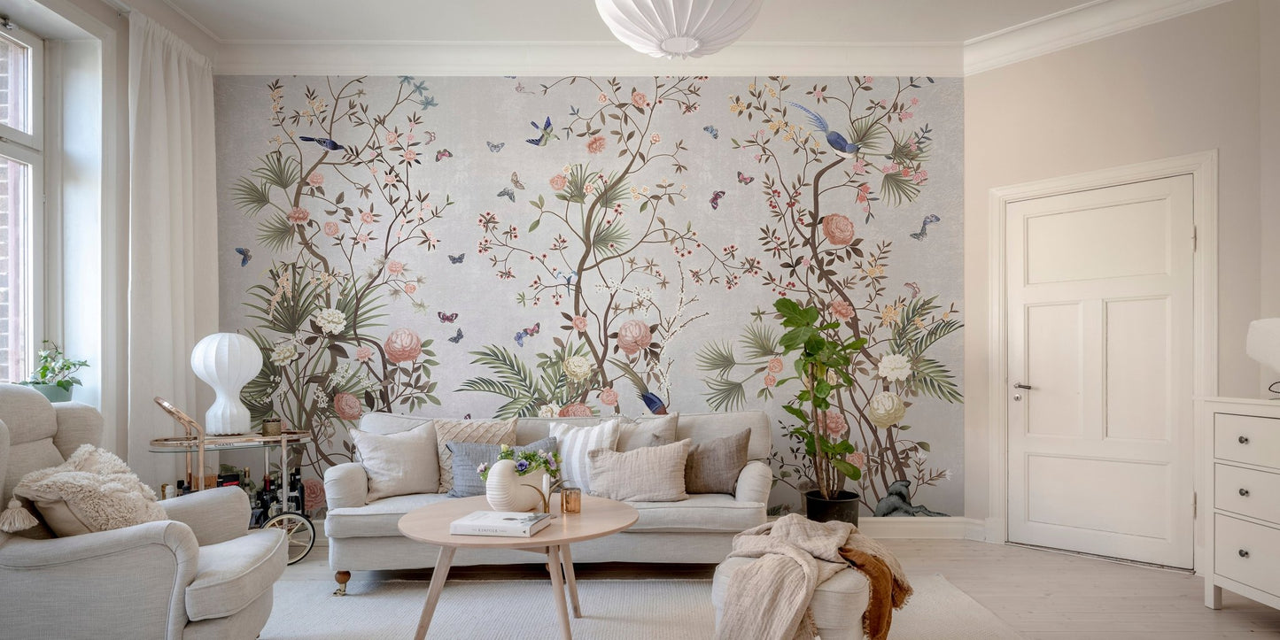 Botanical flower wall mural behind a tan leather couch in a modern living area.