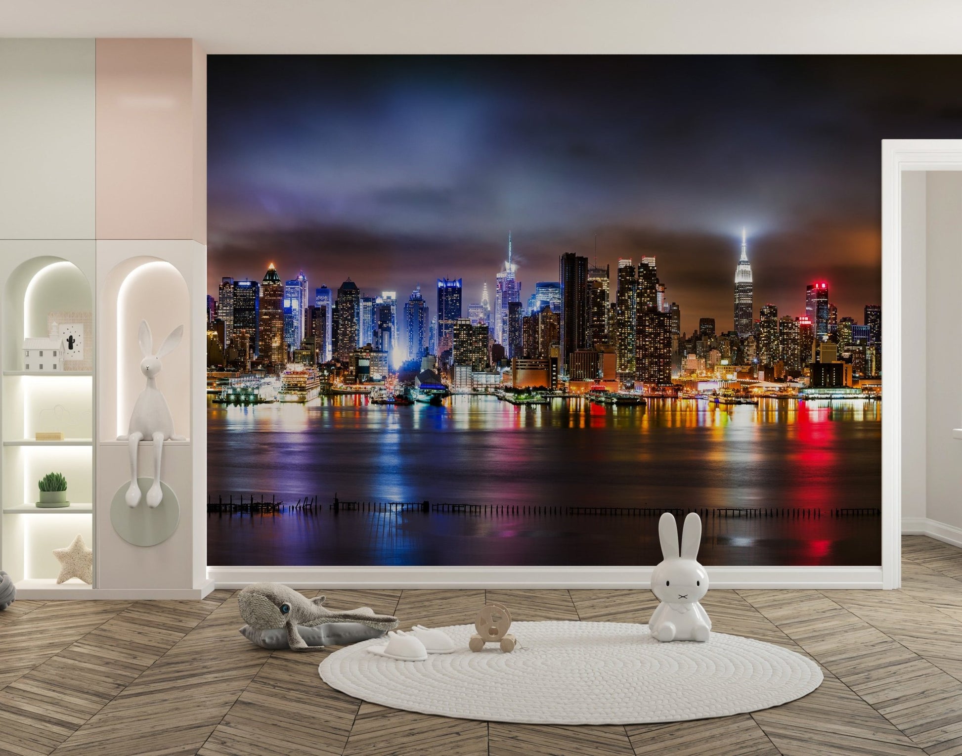 Modern urban city skyline wall mural in a nursery with a round white rug.