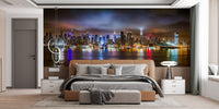Urban cityscape wall mural in a master bedroom with a grey upholstered bed.
