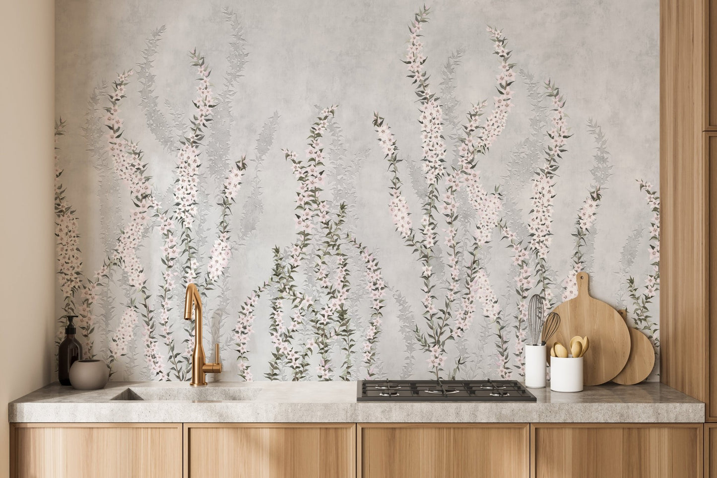 Grey floral wall mural behind modern kitchen counter and light wooden cabinets.
