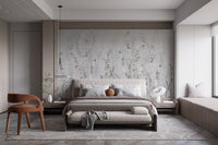 Modern bedroom with low platform bed and climbing floral branch wall mural.