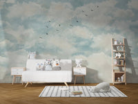 Neutral blue wall mural depicting a peaceful morning cloud with birds.