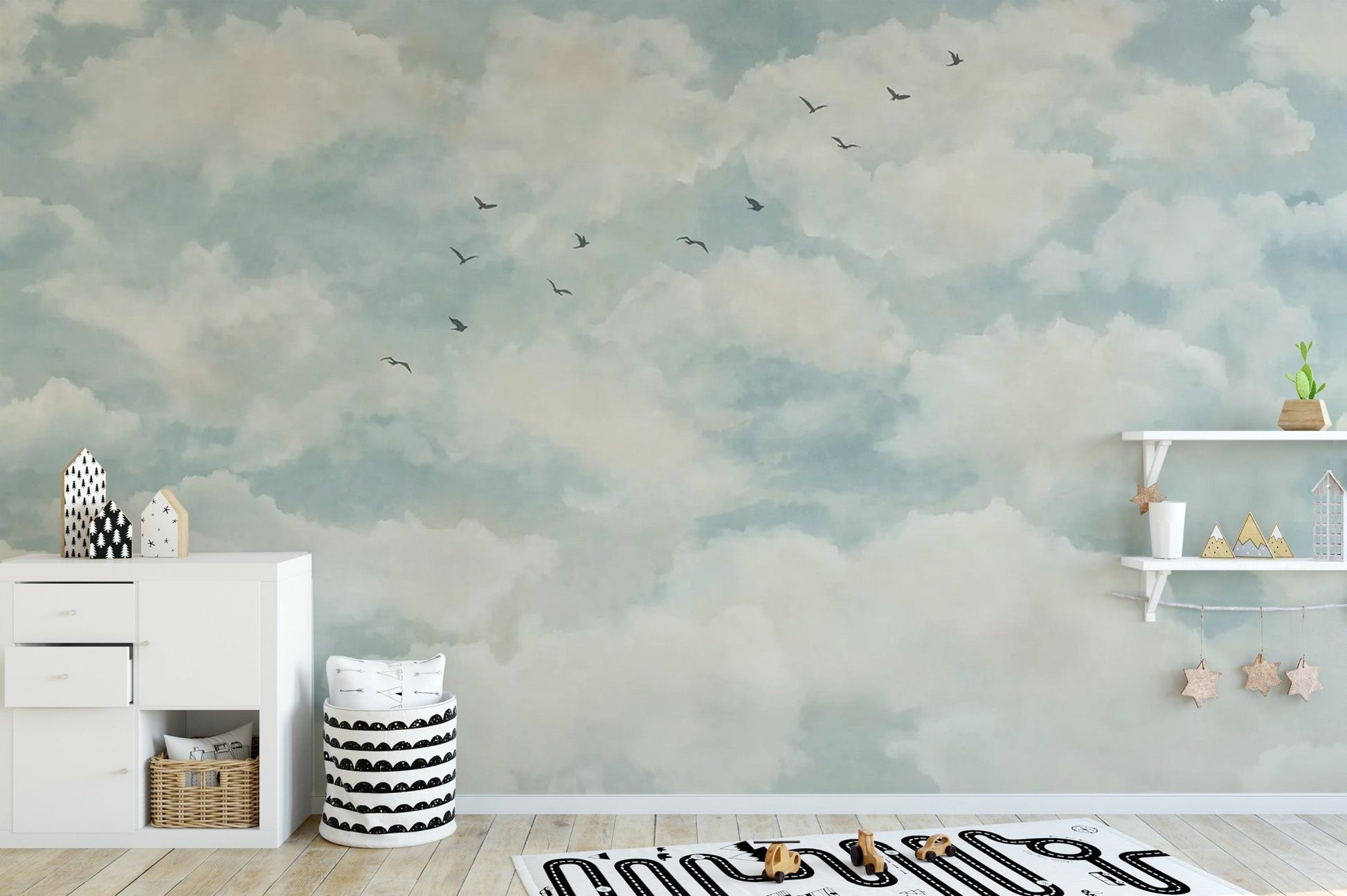Light blue sky wall mural with watercolor clouds and avian silhouettes.