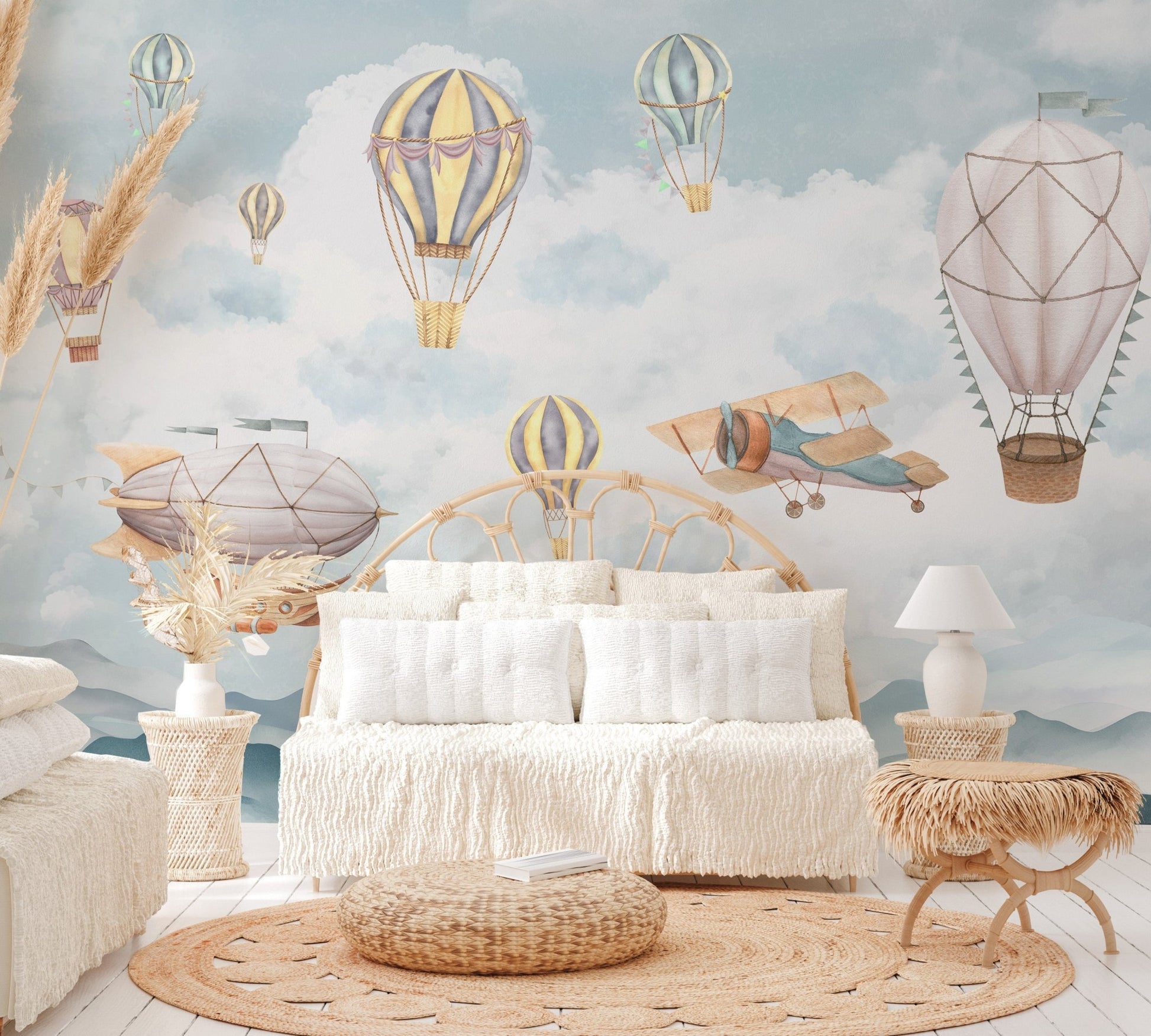 Muted color airship drifting above grey peaks wall mural