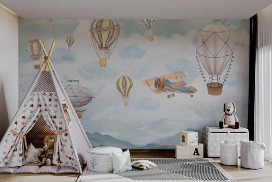 Watercolor hot air balloons and clouds wall mural for kids playroom.
