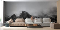 Living space featuring misty mountain peaks wall mural and a tan leather sofa.