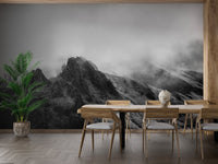 Spacious lounge area with monochrome peak wall mural and neutral decor.