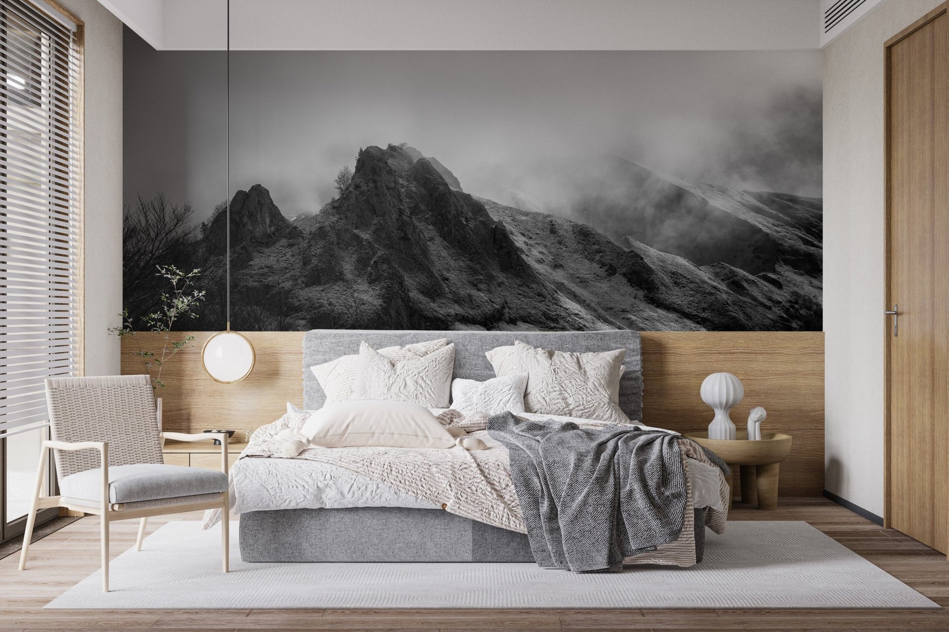 Modern bedroom with Cloudy Skies Over the Peaks Wall Murals behind a grey bed.
