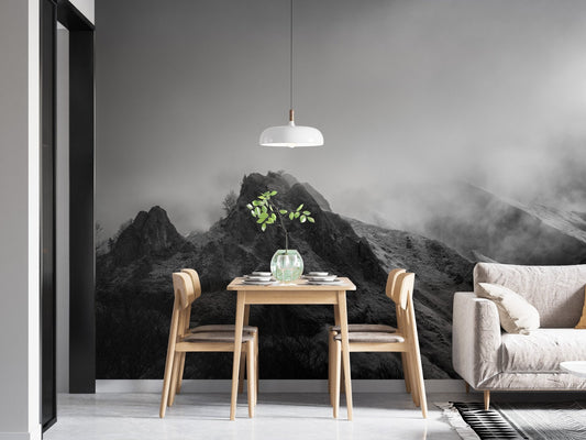 Dining area with Cloudy Skies Over the Peaks Wall Murals and wooden furniture.