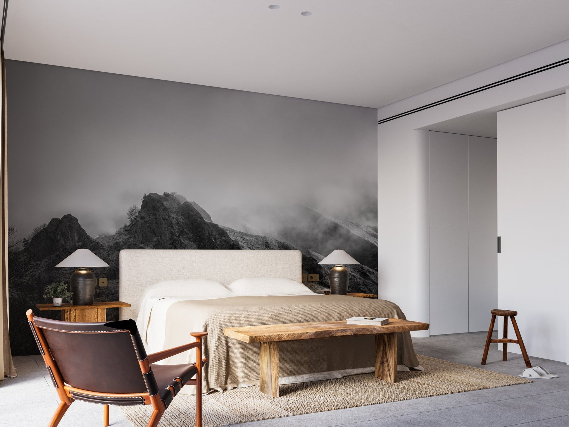 Master suite with landscape peaks wallpaper mural and industrial-style bedside lamps.