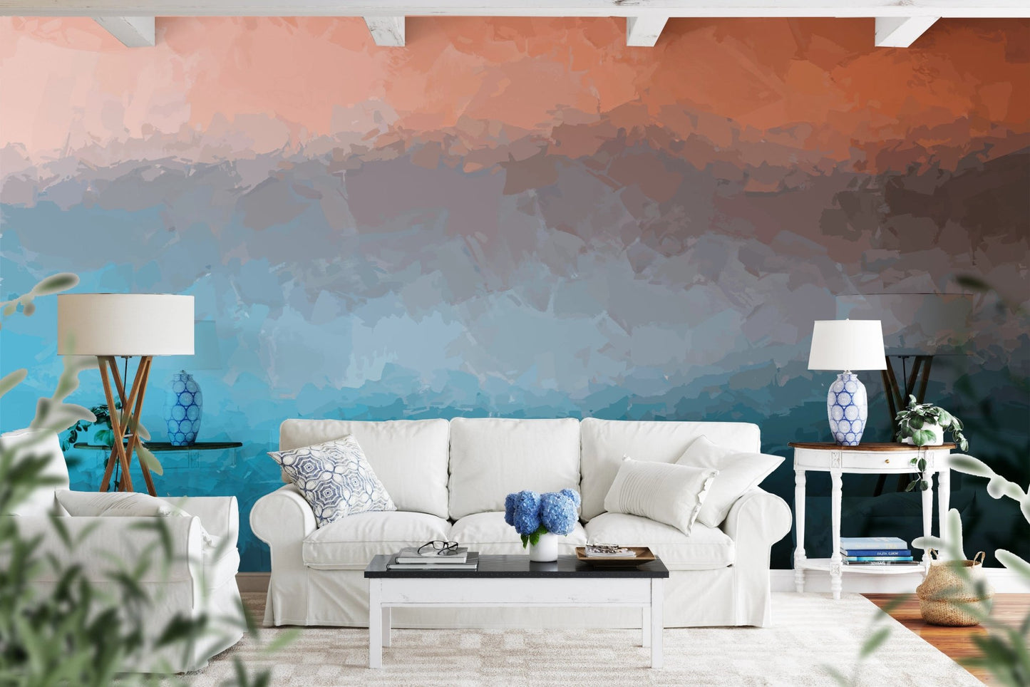 Abstract paint stroke wall mural behind a white sofa and glass table.