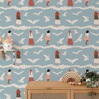 Coastal Repeat Pattern Flying Seagull Birds Kids Wallpaper behind a wooden cabinet.