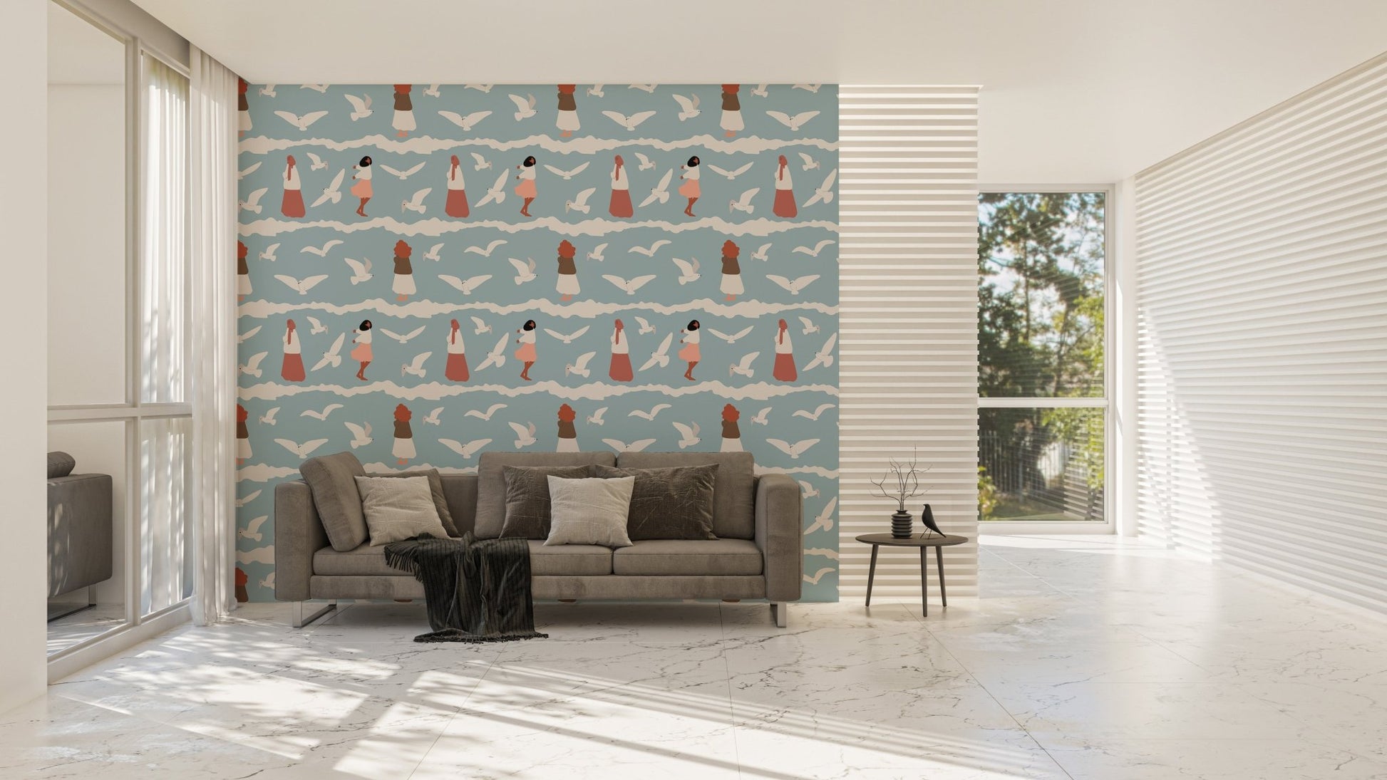 Large wallpaper with bird patterns in a living room with a grey sofa.
