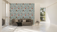 Large wallpaper with bird patterns in a living room with a grey sofa.