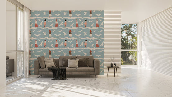 Large wallpaper with bird patterns in a living room with a grey sofa.