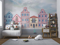 Colorful coastal town wall mural with boats floating on the calm water.